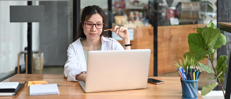 girl typing on laptop